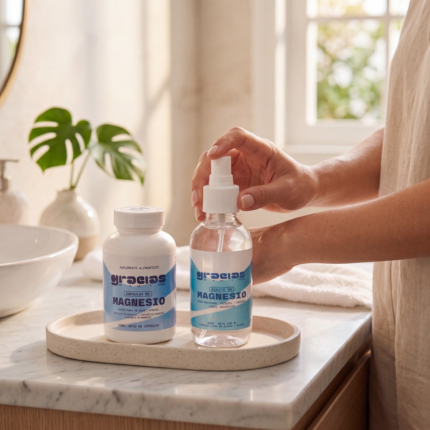 Kit de suplementos Gracias de la Tierra con cápsulas y aceite de magnesio en un baño luminoso